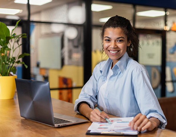 Smiling woman at desk
